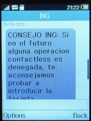 ING Direct, Spanien, Hinweis kontaktloses Bezahlen SMS auf einem Alcatel 2051X Mobiltelefon