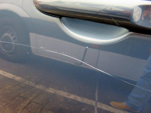 OK RENT A CAR®, Spanien, Nissan Micra mit Kratzern auf der Fahrerseite