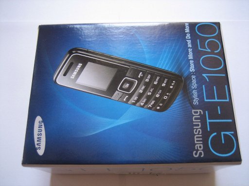 Samsung, Mobiltelefon, GT–E1050, Lieferumfang mit Karton, Bedienungsanleitung in spanisch, Netzteil und Mobiltelefon