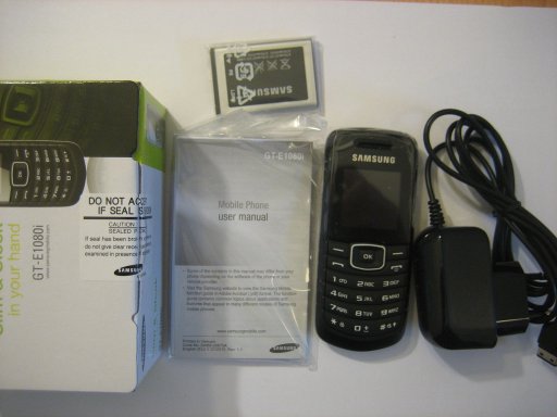 Samsung, Mobiltelefon, GT–E1080i, Lieferumfang mit Mobiltelefon, Netzteil, Anleitung