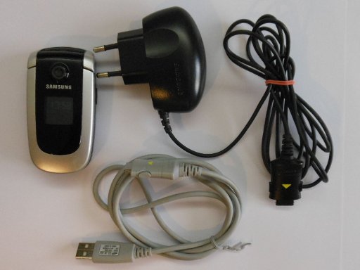 Samsung, Mobiltelefon, SGH–X660, Lieferumfang mit Mobiltelefon, Netzteil und USB Kabel