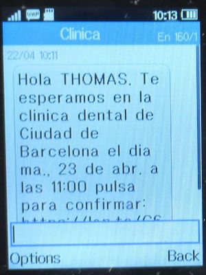 Clínica Odontológica de Postgrados Universitarios, Zahnarztpraxis, Madrid, Spanien, SMS Termin Erinnerung / Bestätigung 2024 auf einem Alcatel 2051X