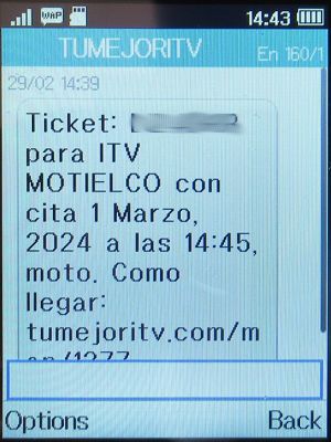 TÜV - ITV Motorrad, Motielco, Madrid, Spanien, TÜV - ITV Motorrad, Motielco SMS mit Gutschein Code und Termin auf einem Alcatel 2051X